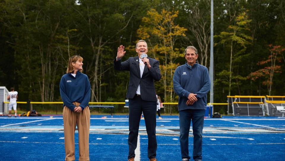 President Herbert announces the "Doing Our Part" campaign on the football field