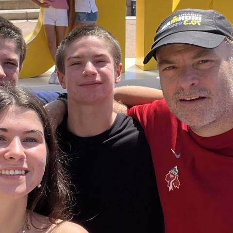 UNE's Norm O'Reilly poses with family in a plaza in Nice, France